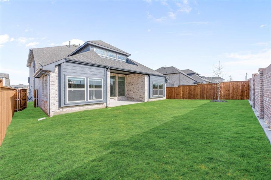 Exterior details and patio area of a home in Creekview Meadows, Pilot Point (Image 3).