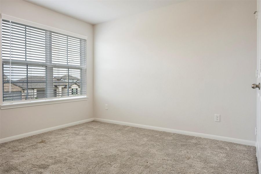 Spacious, unfurnished interior of a new home in Sunterra, Katy (Image 34).