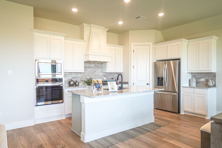 Representative furnished interior of a home built from the The Aleutian by Lillian Custom Homes in Polo Ridge, Heath (Image 10).