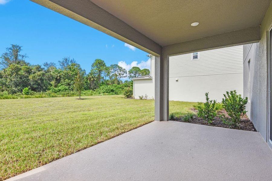 Exterior details and patio area of a home in Ardisia Park, New Smyrna Beach (Image 3).