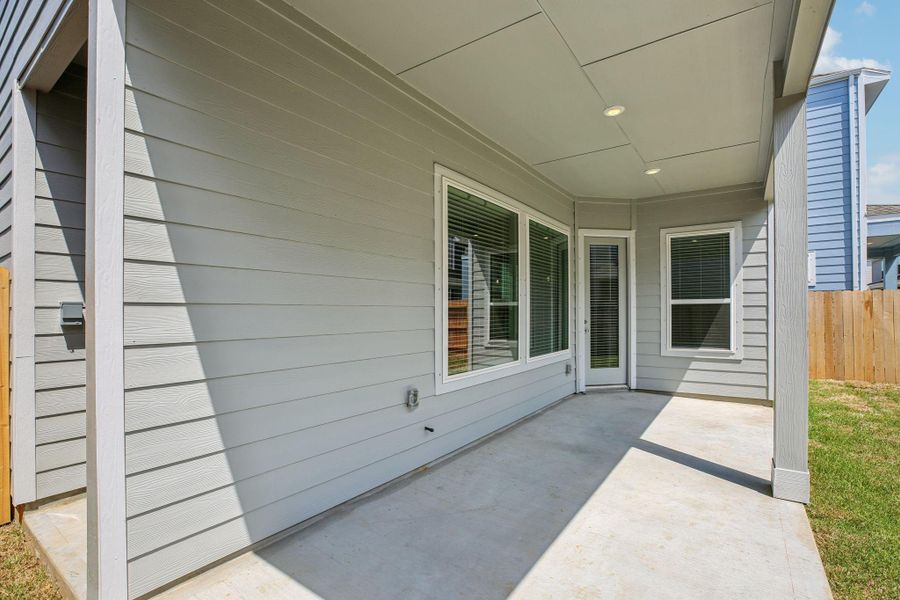 Front exterior of a new home in Kemah Crossing - Luxe Series, Kemah, TX, highlighting curb appeal (Image 21). Front exterior of a new home in Kemah Crossing - Luxe Series, Kemah, TX, highlighting curb appeal (Image 21).