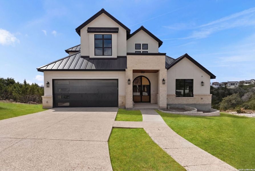 Front exterior of a new home in , Boerne, TX, highlighting curb appeal (Image 27).