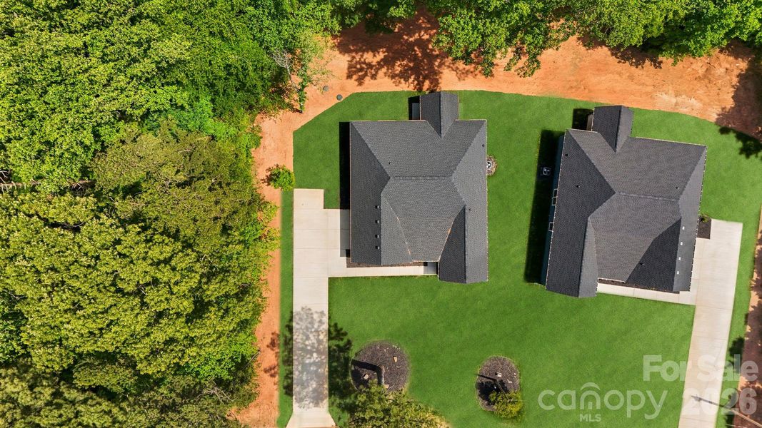 Front exterior of a new home in , Huntersville, NC, highlighting curb appeal (Image 24).