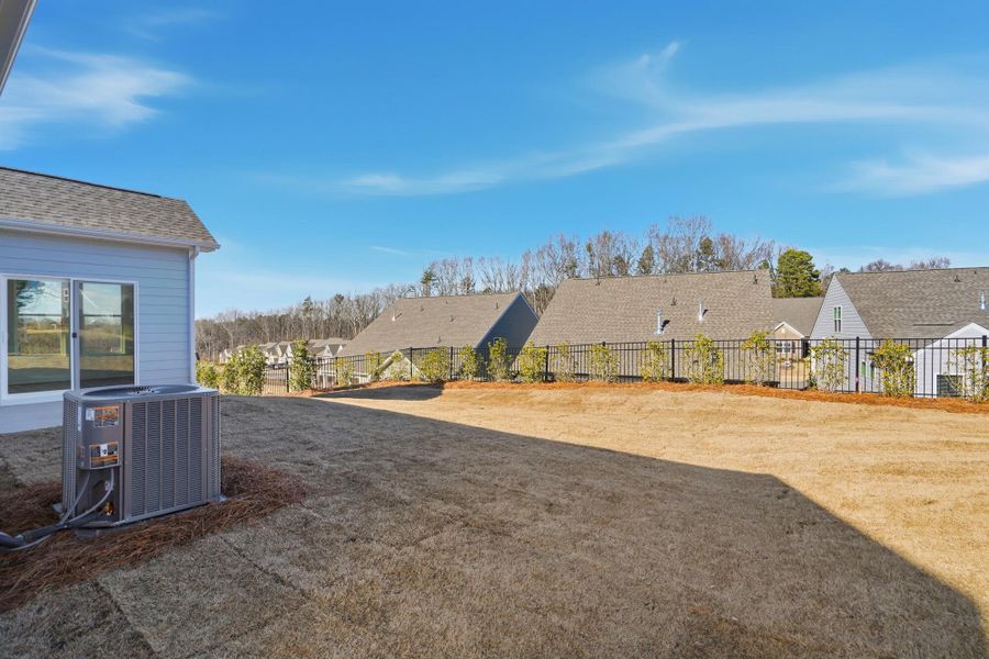 Exterior details and patio area of a home in Villas at Prestwick, Mooresville (Image 30).