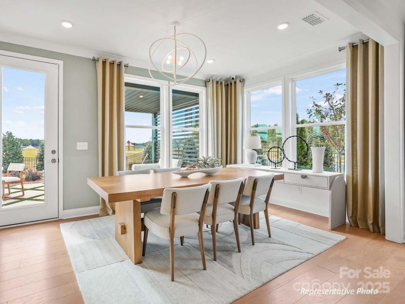 Airy sunroom off the gathering room