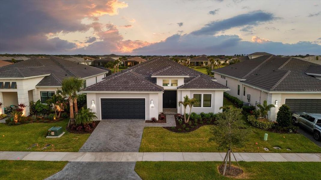 Front exterior of a new home in , Sarasota, FL, highlighting curb appeal (Image 26).