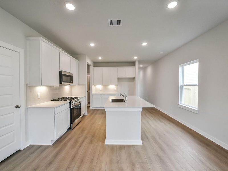 Furnished interior view inside a new home in Caney Creek Place, Conroe (Image 10).