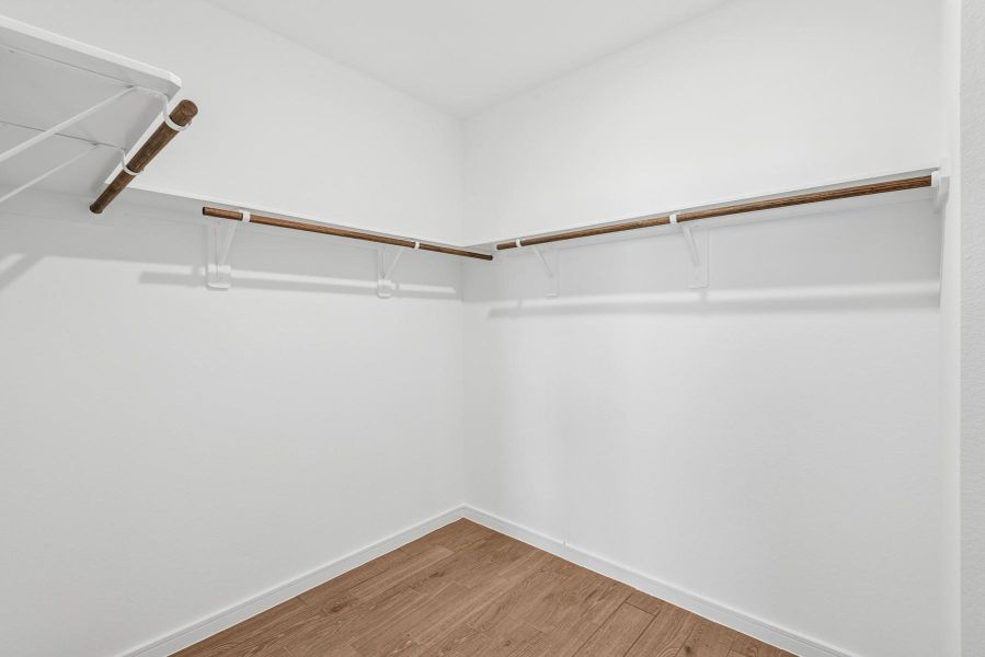 Walk-in closet in the primary suite Walk-in closet in the primary suite