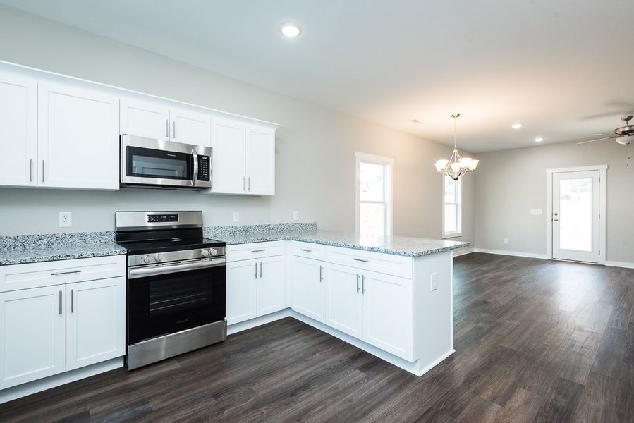 Representative furnished interior of a home built from the Ford by Foundation Home Builders LLC in Pallini Place, Ossipee (Image 4).