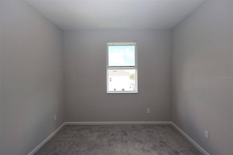 Spacious, unfurnished interior of a new home in Tribute at Ovation, Winter Garden (Image 9).