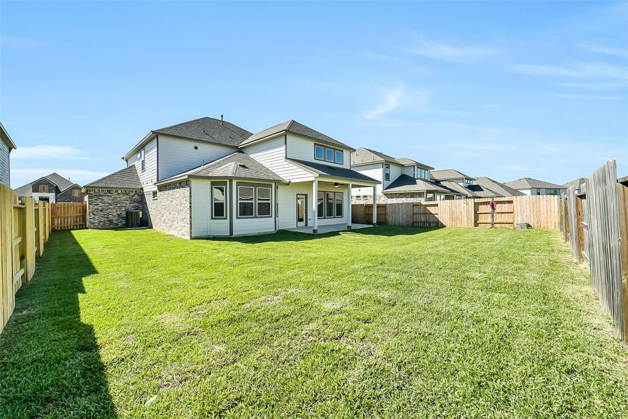 Exterior details and patio area of a home in Stone Creek Ranch, Hockley (Image 26).