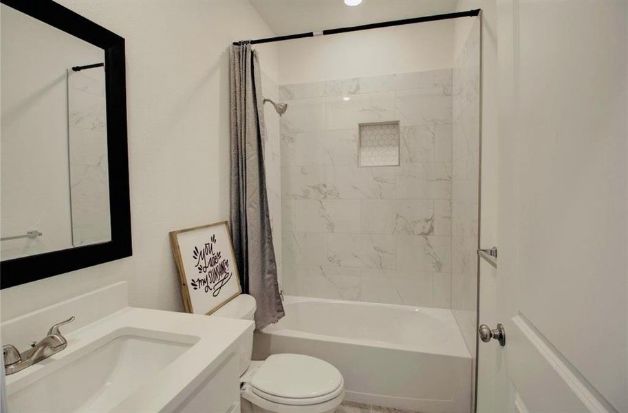 Full bathroom with shower / bathtub combination with curtain and vanity Full bathroom with shower / bathtub combination with curtain and vanity