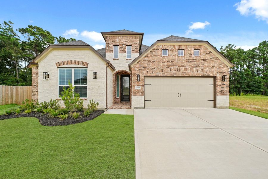 Front exterior of a new home in Barton Creek Ranch, Conroe, TX, highlighting curb appeal (Image 15). Front exterior of a new home in Barton Creek Ranch, Conroe, TX, highlighting curb appeal (Image 15).