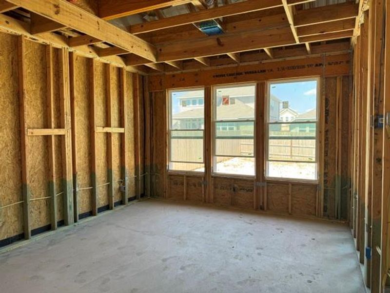 A glimpse into a future living space, framed by natural light and structural readiness.