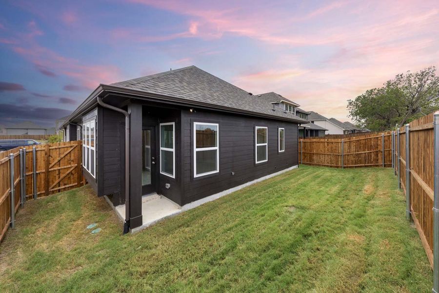 Exterior details and patio area of a home in Keeneland, Aubrey (Image 4).
