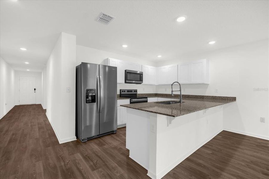 Furnished interior view inside a new home in Poinciana Village, Kissimmee (Image 4).
