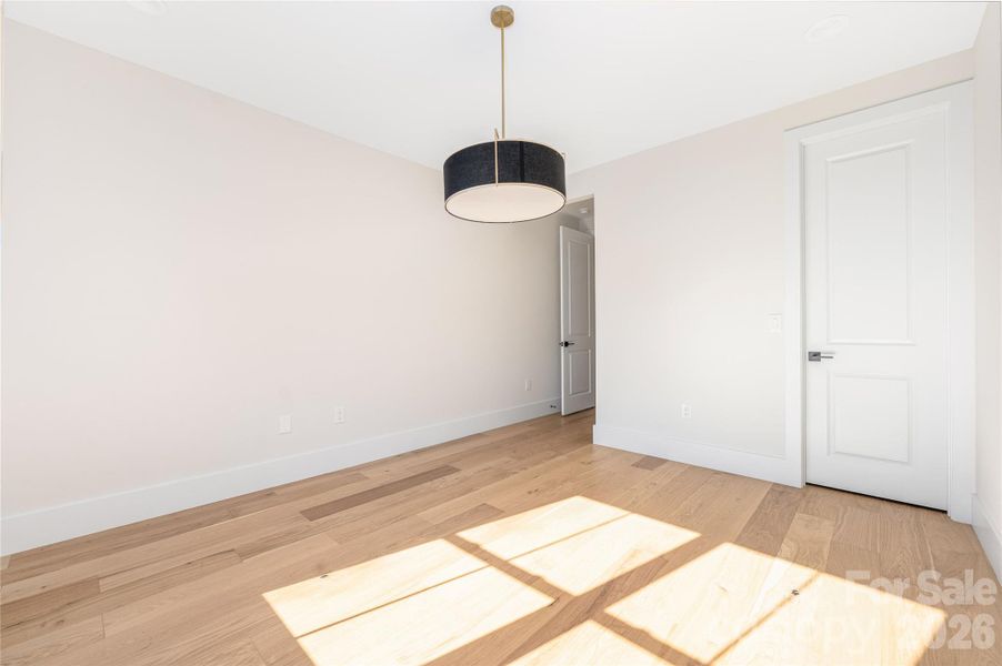 Upper-level guest bedroom 1.