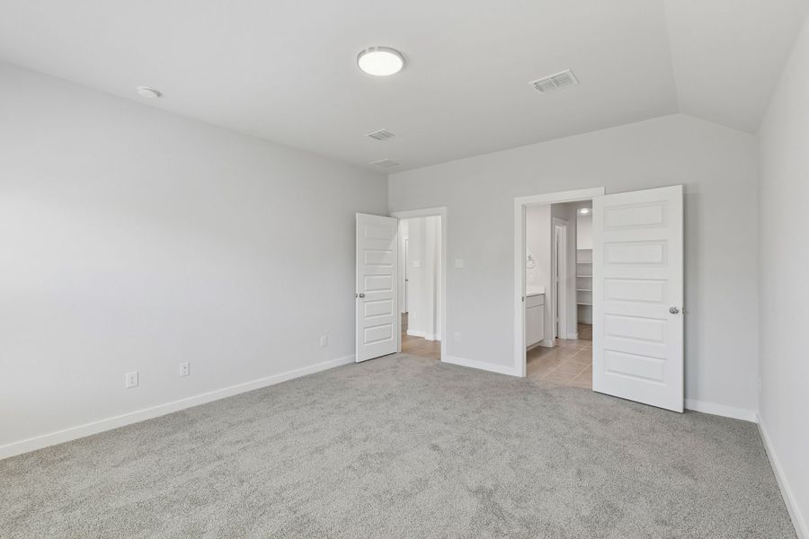 Primary Suite in the Harrison home plan by Trophy Signature Homes – REPRESENTATIVE PHOTO