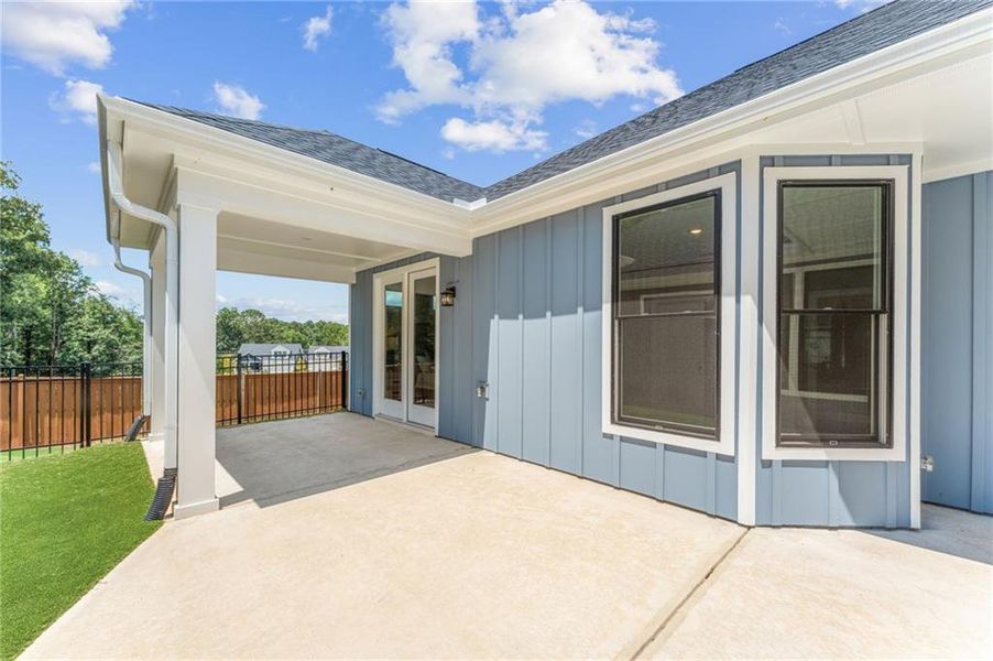 Exterior details and patio area of a home in The Courtyards at Redbud Lane, Canton (Image 17).