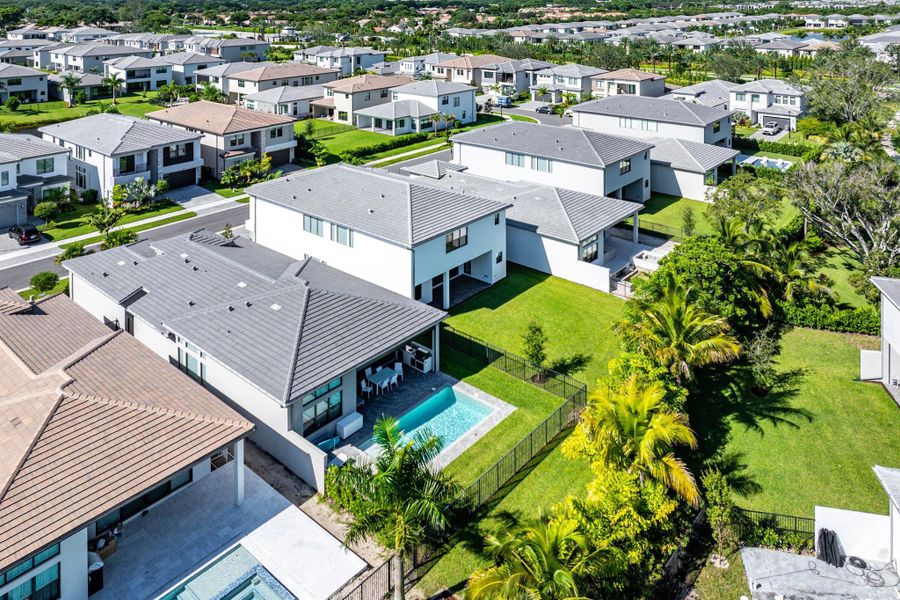 Front exterior of a new home in Lotus Edge, Boca Raton, FL, highlighting curb appeal (Image 33).