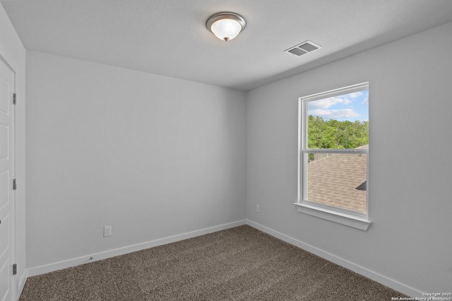 Spacious, unfurnished interior of a new home in The Meadows at Hunters Ranch, San Antonio (Image 22).