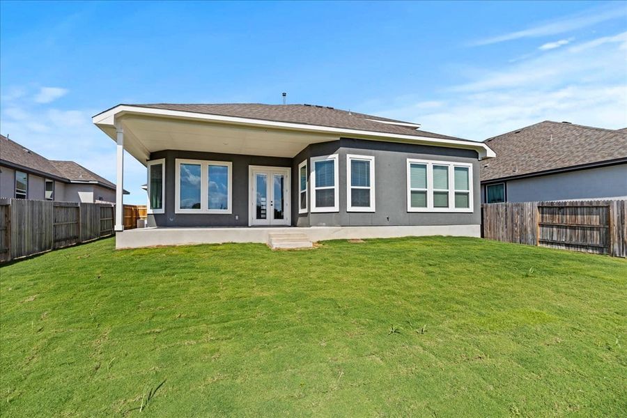 Exterior details and patio area of a home in Village at Three Oaks, Seguin (Image 24).