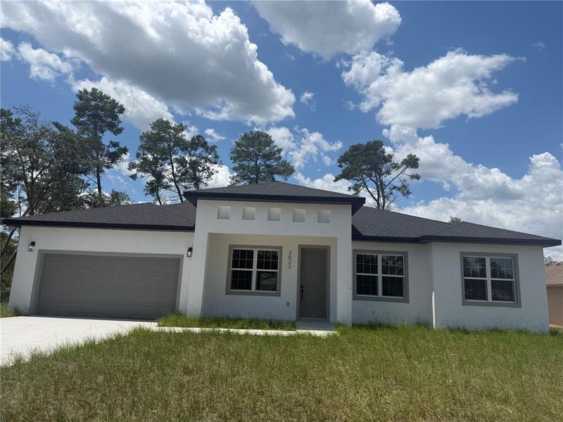 Front exterior of a new home in , Ocala, FL, highlighting curb appeal (Image 22).