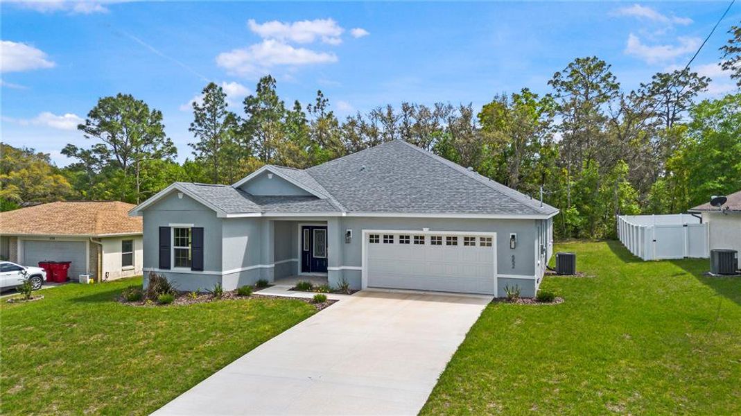 Front exterior of a new home in , Citrus Springs, FL, highlighting curb appeal (Image 2).