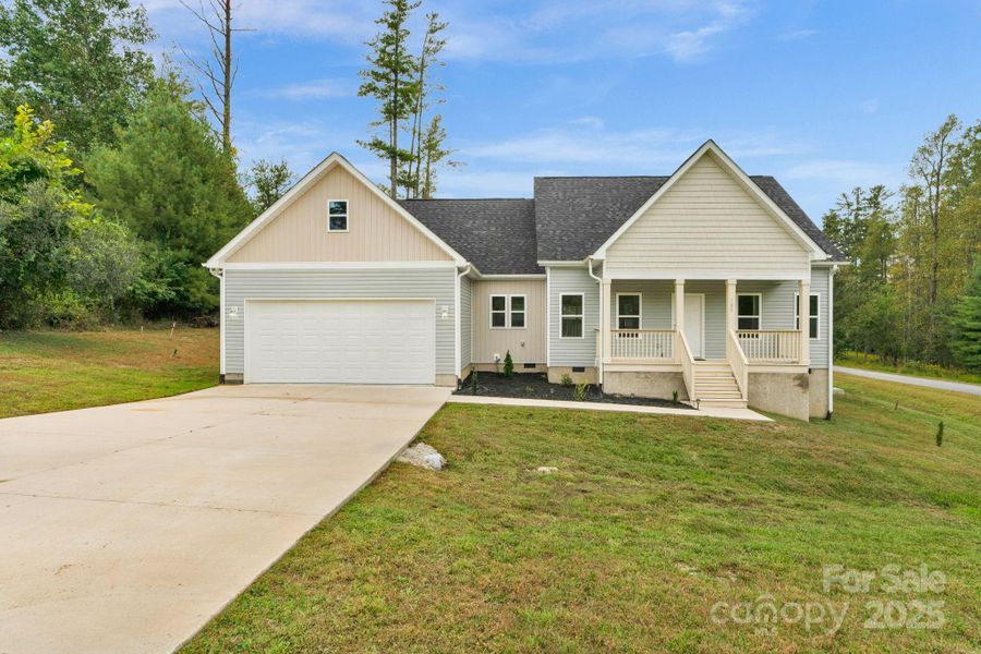 Front exterior of a new home in , Hendersonville, NC, highlighting curb appeal (Image 1).