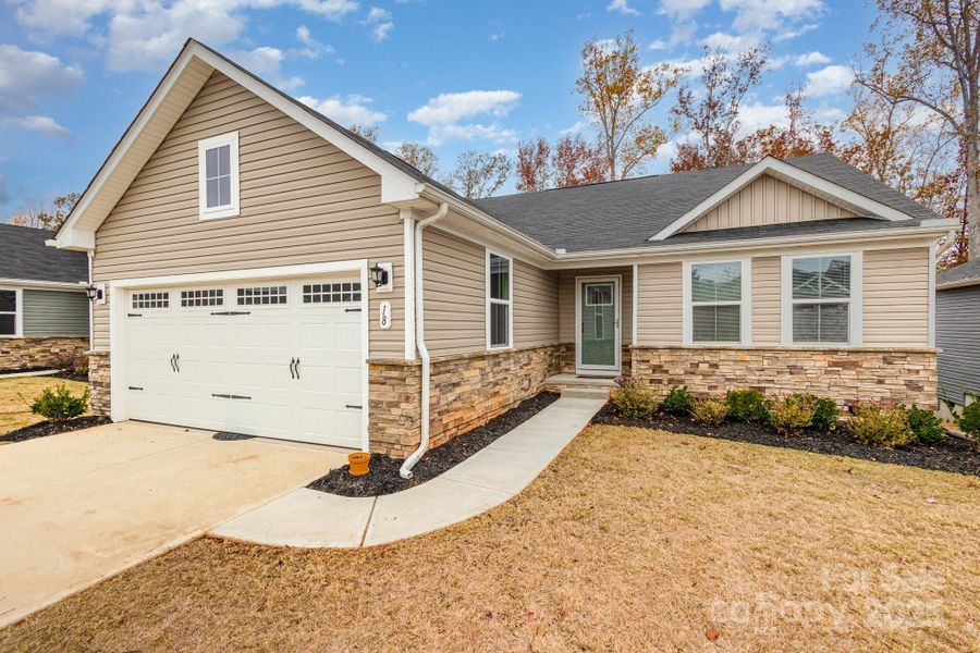 Front exterior of a new home in , Greenville, SC, highlighting curb appeal (Image 22).