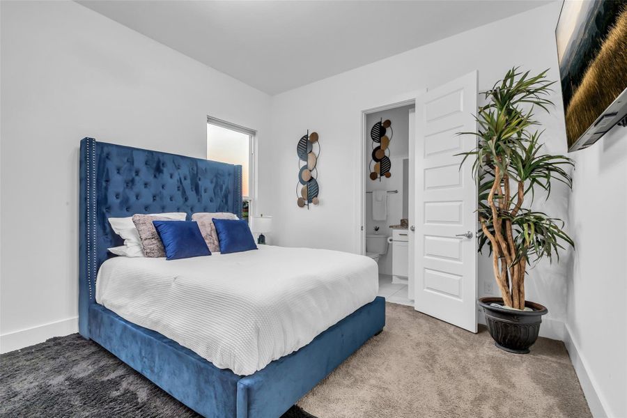 Bedroom Suite:Bathed in natural light, this private suite pairs modern simplicity with comfort. A plush upholstered bed, soft textures, and a direct en suite bath create a tranquil retreat designed for rest and refinement.