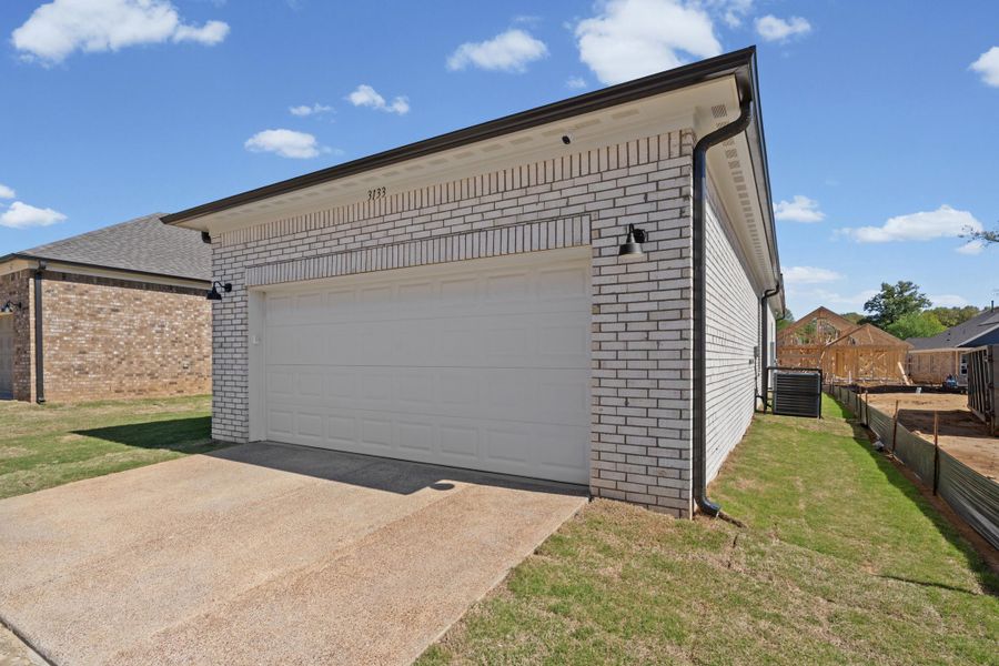 Garage with concrete driveway