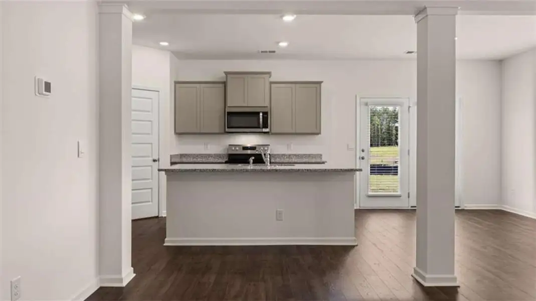 Furnished interior view inside a new home in Oakchase at Hampton, Hampton (Image 3).