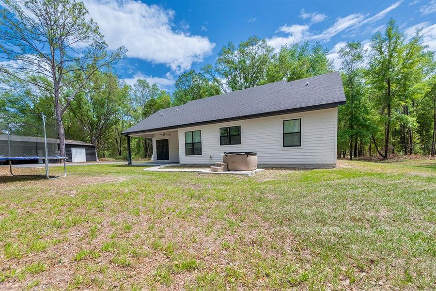 Exterior details and patio area of a home in , Fort White (Image 4).
