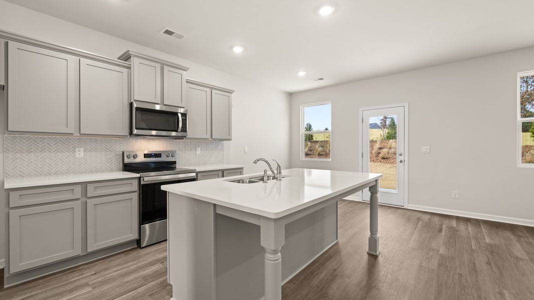 Representative furnished interior of a home built from the ANSLEY Express by D.R. Horton in WillowBrook, Winder (Image 6).