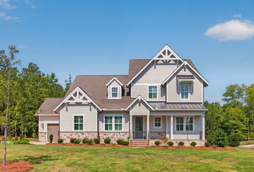 Front exterior of a new home in McLean - South Shore, Clover, SC, highlighting curb appeal (Image 1). Front exterior of a new home in McLean - South Shore, Clover, SC, highlighting curb appeal (Image 1).