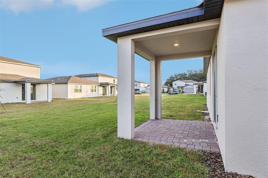 Exterior details and patio area of a home in The Reserve at Twin Lakes, St. Cloud (Image 21).