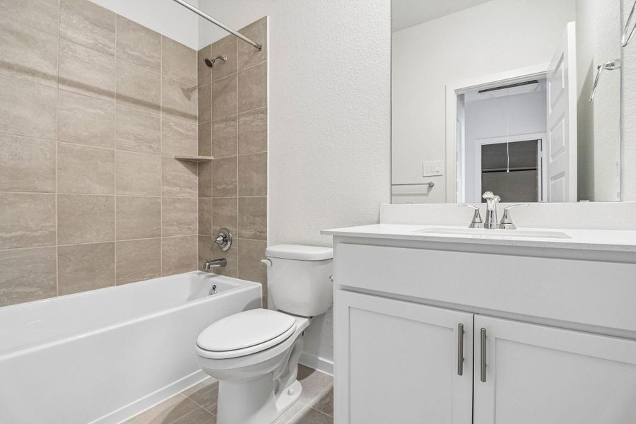 Photos are not of the actual home, but are photos of the builder home with same floorplan with similar interior finishes.