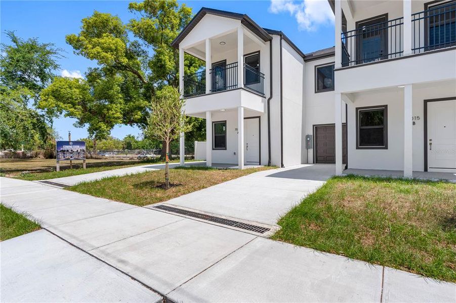 Front exterior of a new home in , Tampa, FL, highlighting curb appeal (Image 26).