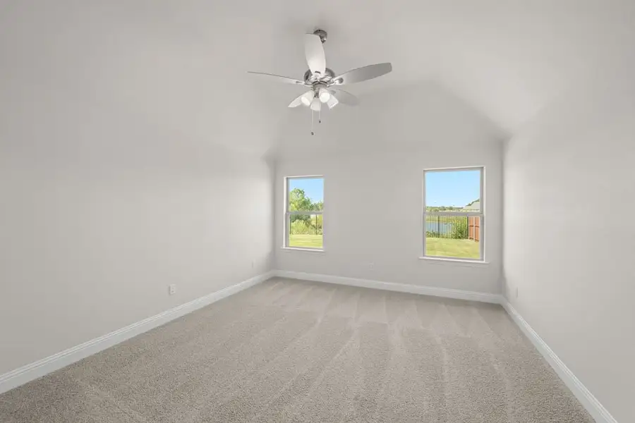 Front exterior of a new home in Still Water Lake, Godley, TX, highlighting curb appeal (Image 2). Front exterior of a new home in Still Water Lake, Godley, TX, highlighting curb appeal (Image 2).