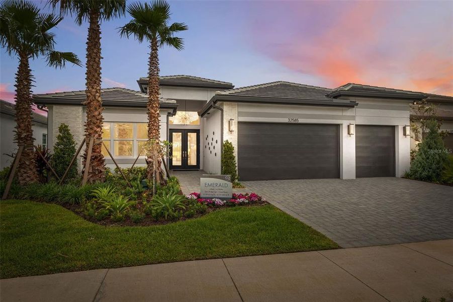 Front exterior of a new home in Valencia Ridge, Wesley Chapel, FL, highlighting curb appeal (Image 2).