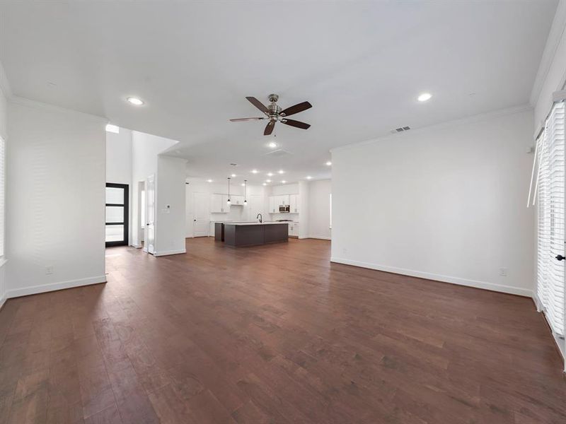 Imagine hosting family and friends in this spacious living area! The wood flooring in the living area is part of our Standard Features. (Sample photos of a completed Warwick floor plan. The image may feature alternative selections and/or upgrades.)