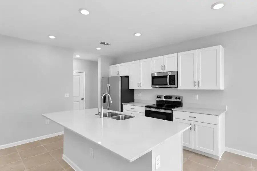 Representative furnished interior of a home built from the Dove by Taylor Morrison in Azure at Solaeris, Port St. Lucie (Image 9).