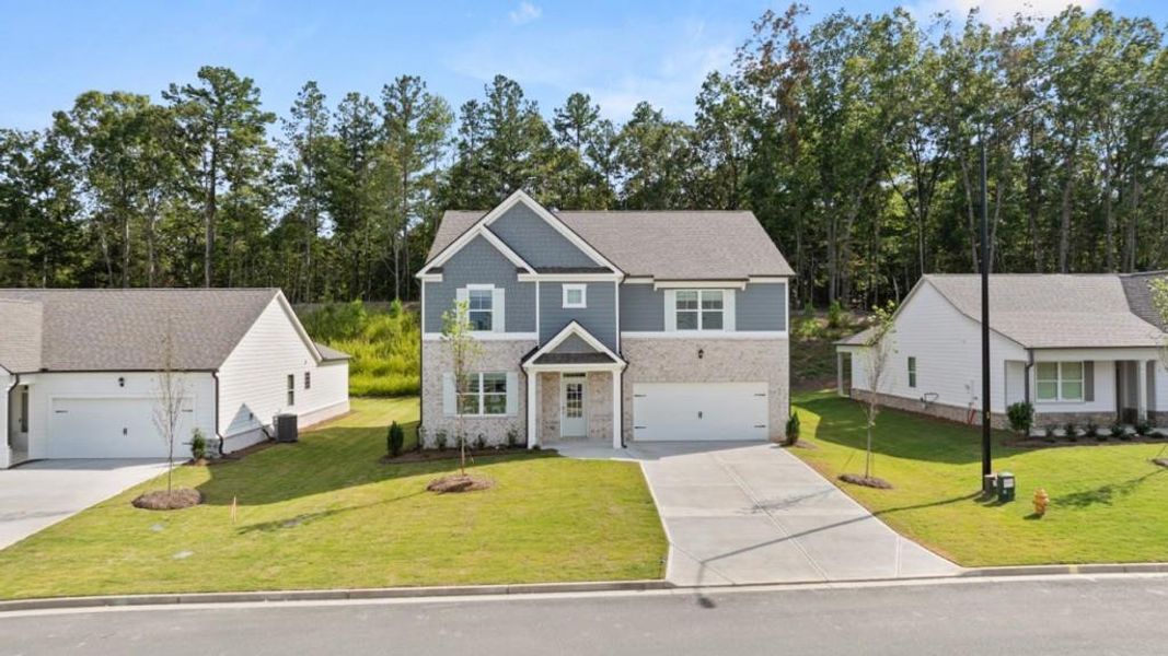Front exterior of a new home in Parkside at Carter Grove, Cartersville, GA, highlighting curb appeal (Image 2).