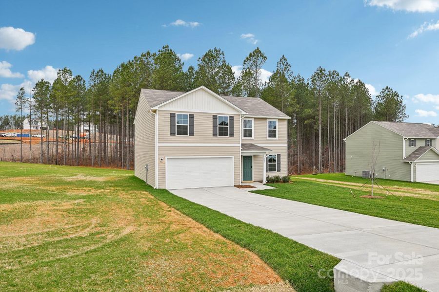 Front exterior of a new home in The Pines at Stoney Point, Lexington, NC, highlighting curb appeal (Image 8). Front exterior of a new home in The Pines at Stoney Point, Lexington, NC, highlighting curb appeal (Image 8).