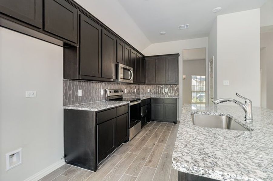 Furnished interior view inside a new home in Mustang Place II, Heartland (Image 8).