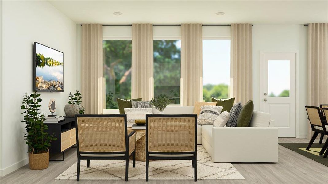 Living area featuring plenty of natural light and light hardwood / wood-style flooring