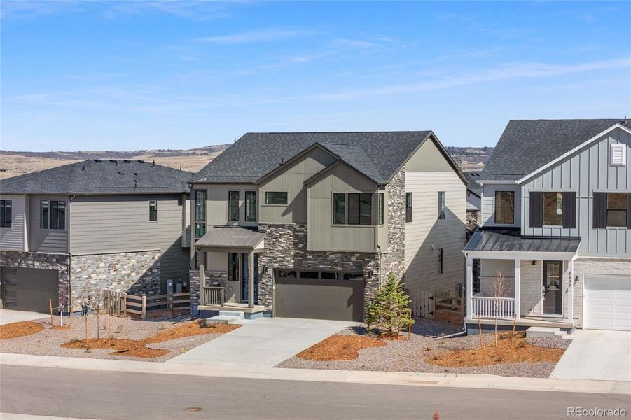 Front exterior of a new home in , Littleton, CO, highlighting curb appeal (Image 27).