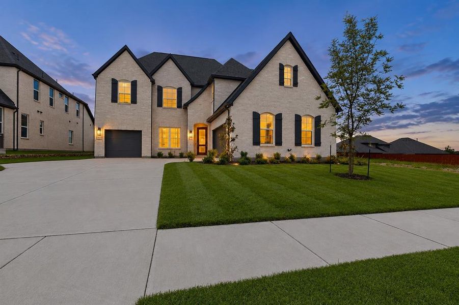 Front exterior of a new home in The Homestead - 62', Rockwall, TX, highlighting curb appeal (Image 2). Front exterior of a new home in The Homestead - 62', Rockwall, TX, highlighting curb appeal (Image 2).