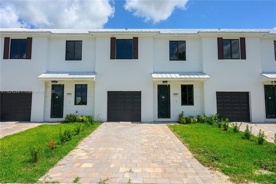 Front exterior of a new home in , Florida City, FL, highlighting curb appeal (Image 24).